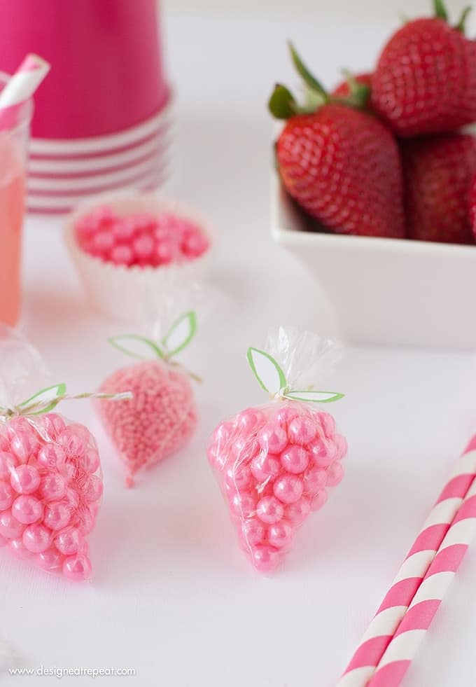 DIY Strawberry Sprinkle Party Favors | All you need is a plastic bag, string, sprinkles, and the free "leaf" printable found on Design Eat Repeat. So easy to make!