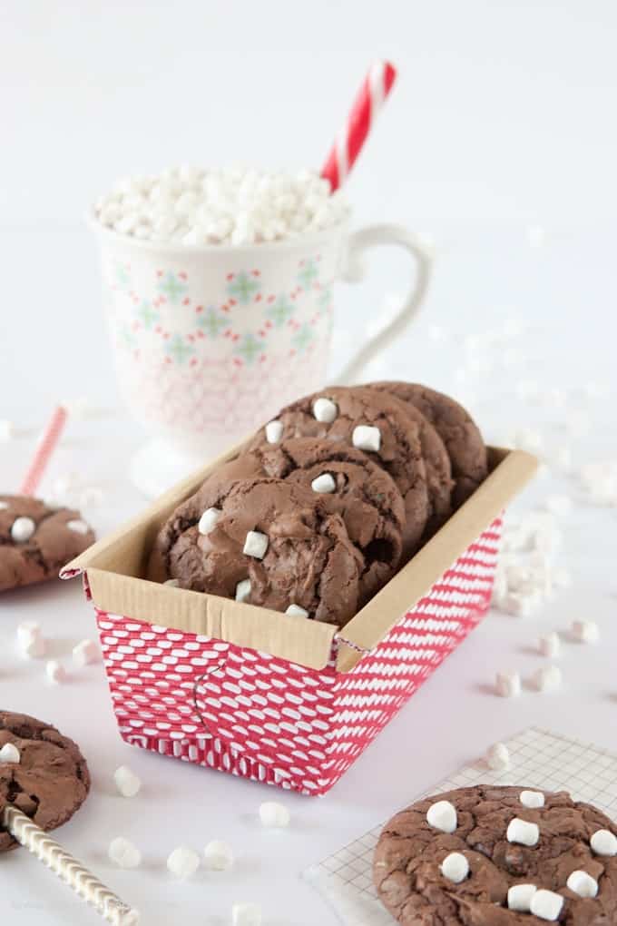 Make these Hot Chocolate Brownie Cookies using a boxed brownie mix & one cup of chocolate cake mix! The cake mix makes them thick, while still keeping a chewy, chocolately texture! Fun way to use those mini marshallows & makes a fun holiday gift idea!
