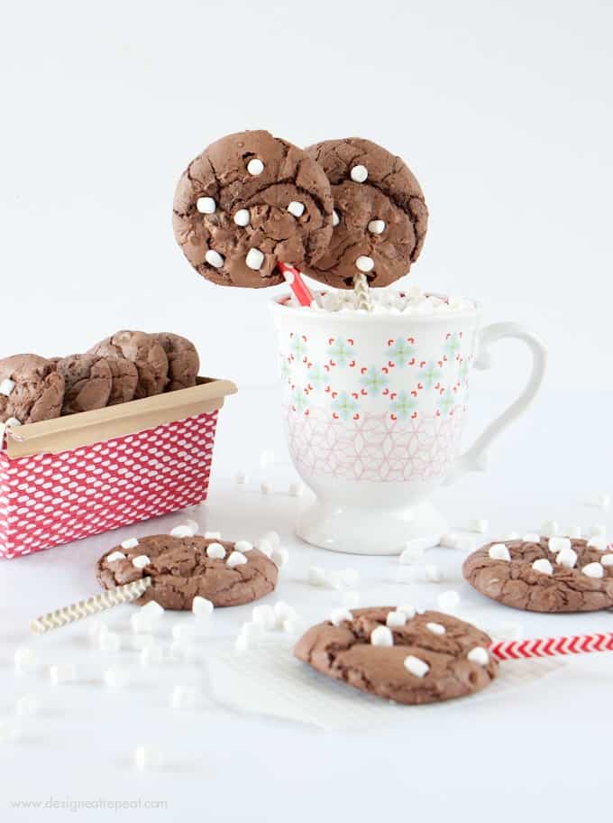 Make these Hot Chocolate Brownie Cookies using a boxed brownie mix & one cup of chocolate cake mix! The cake mix makes them thick, while still keeping a chewy, chocolately texture! Fun way to use those mini marshallows!