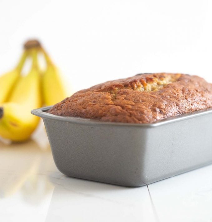 Pan of moist banana bread in metal loaf pan