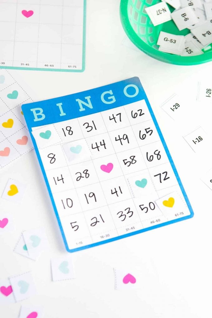 Fill in the blank blue bingo cards with heart tokens