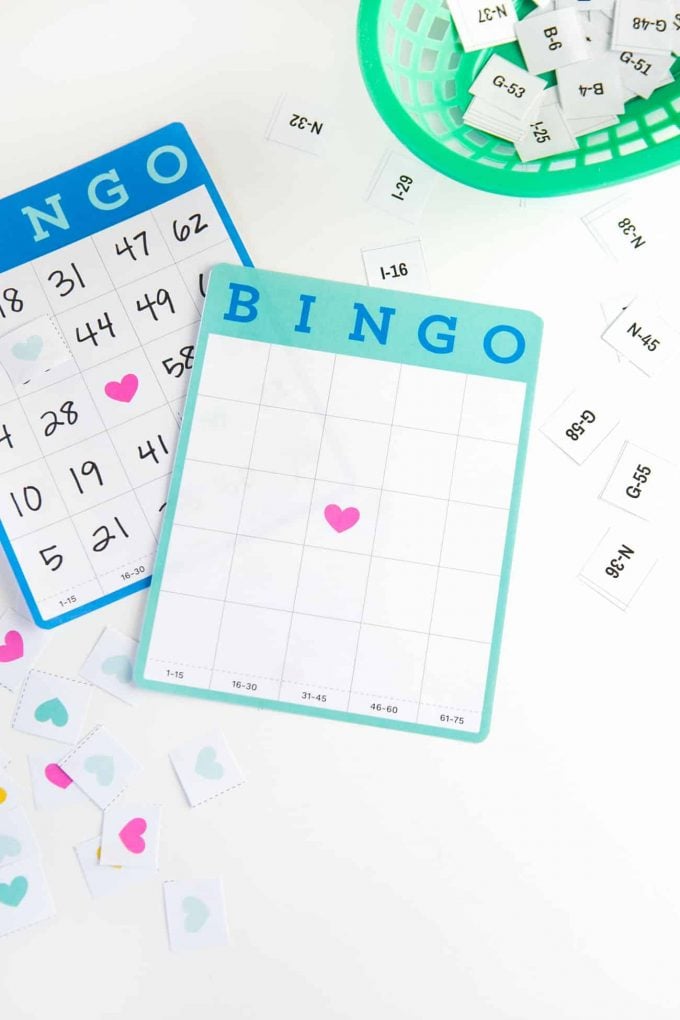 Cute blank bingo cards with hearts and bingo marker pieces