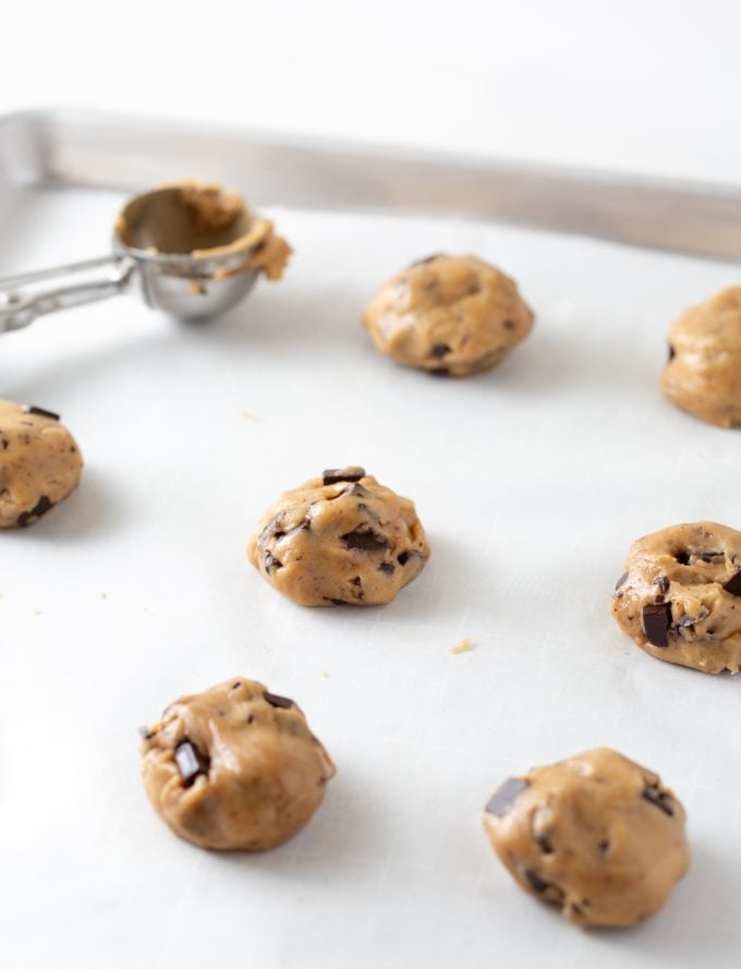 Chocolate chip cookie dough scoops on baking tray
