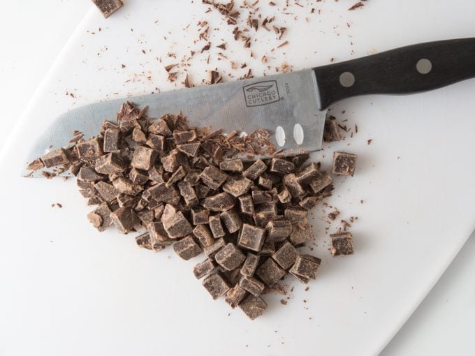 Knife chopping chocolate chunks