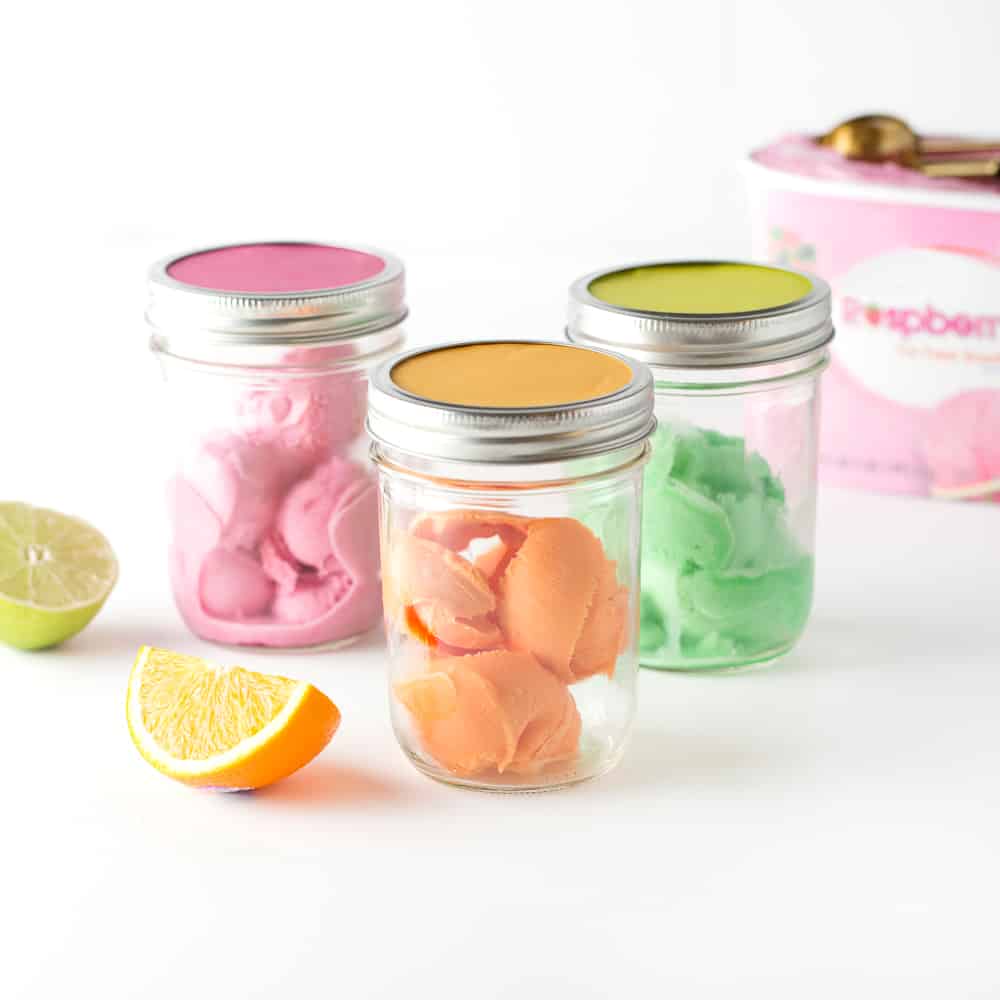 Raspberry, Orange, and Lime Sherbet scoops in mason jar to create DIY punch bar.