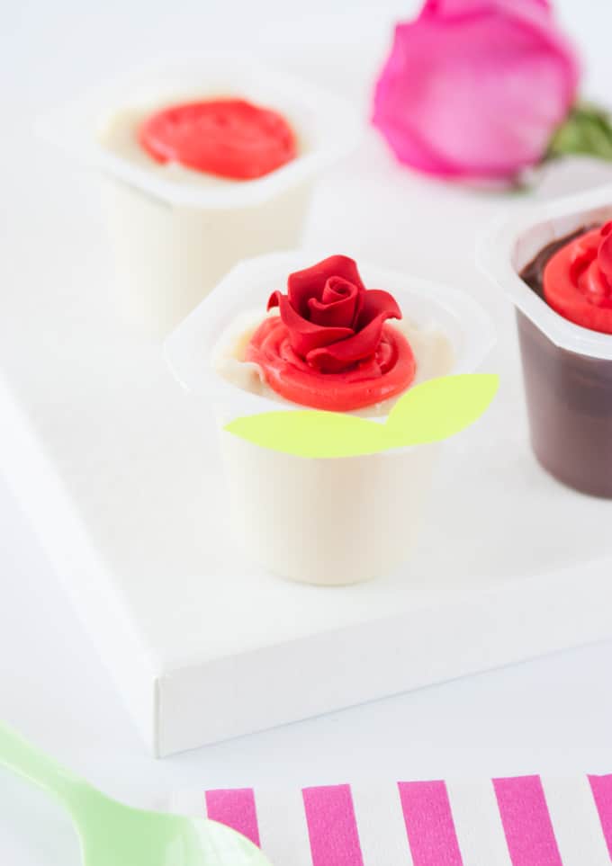 Dye vanilla pudding red and swirl on top of Snack Pack pudding cups to create Valentine's Day roses! So fun and EASY!