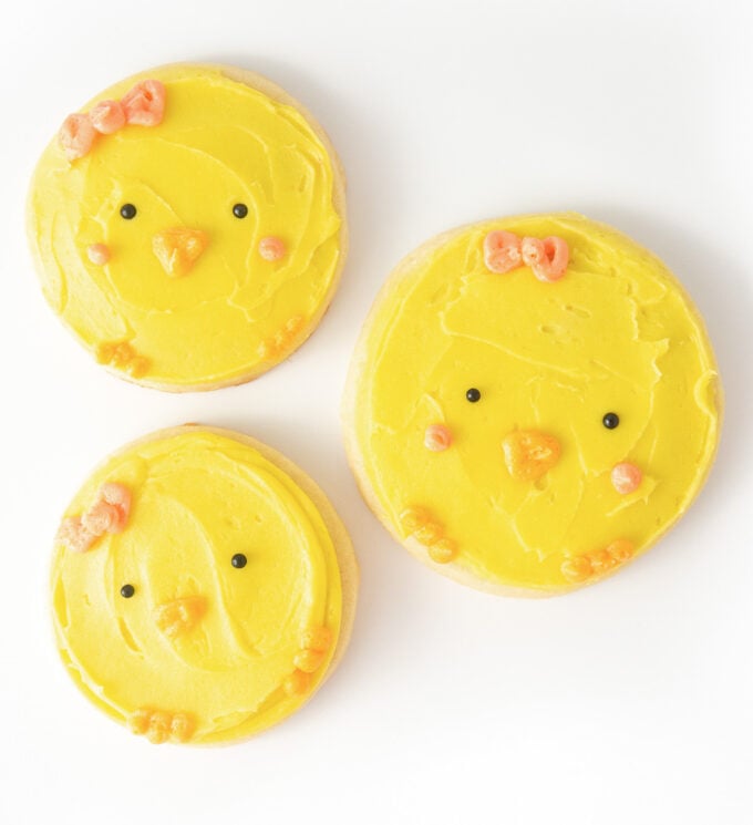 Yellow decorated sugar cookies made to look like cute baby chicks