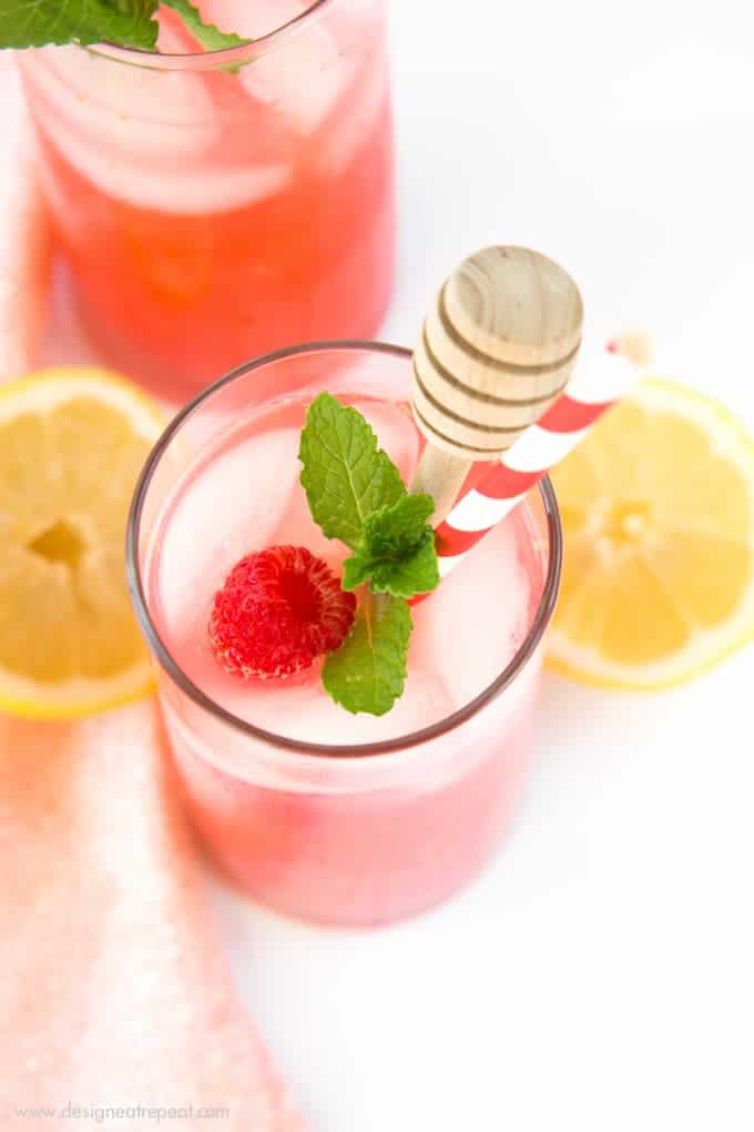 Add pureed raspberries to lemonade for a colorful and refreshing summer drink! Find the recipe for Homemade Raspberry Lemonade at Design Eat Repeat.