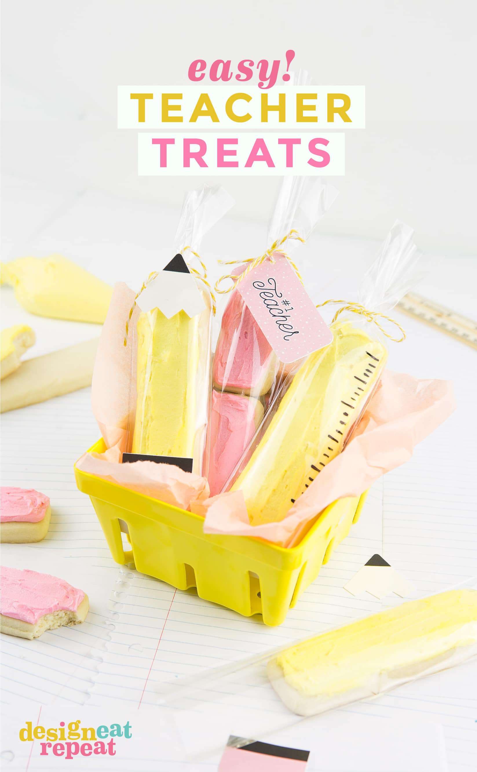 Yellow berry basket of sugar cookie sticks decorated like a pencil, eraser, and ruler.