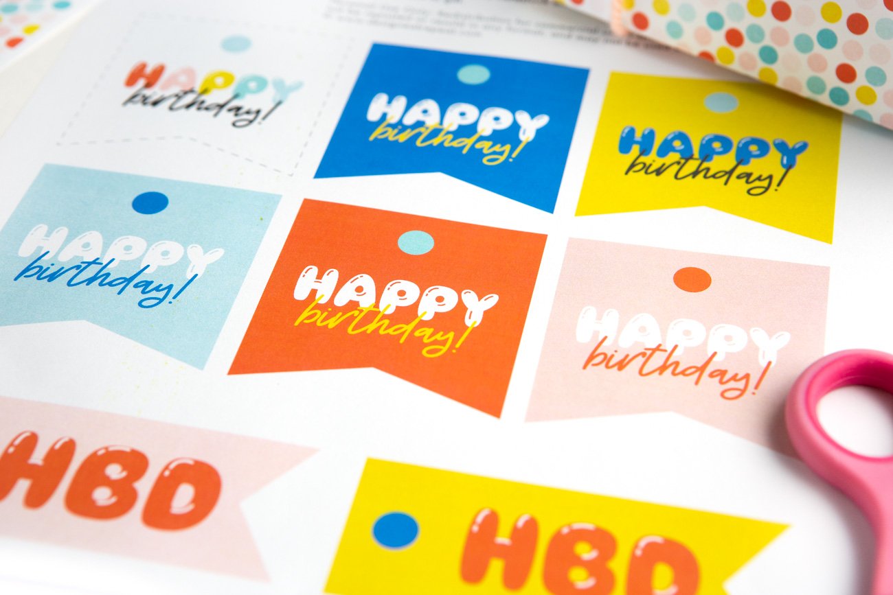 Sheet of colorful Free Sheet of Printable Happy Birthday Tags with phrases HBD, YAY, and Happy Birthday!