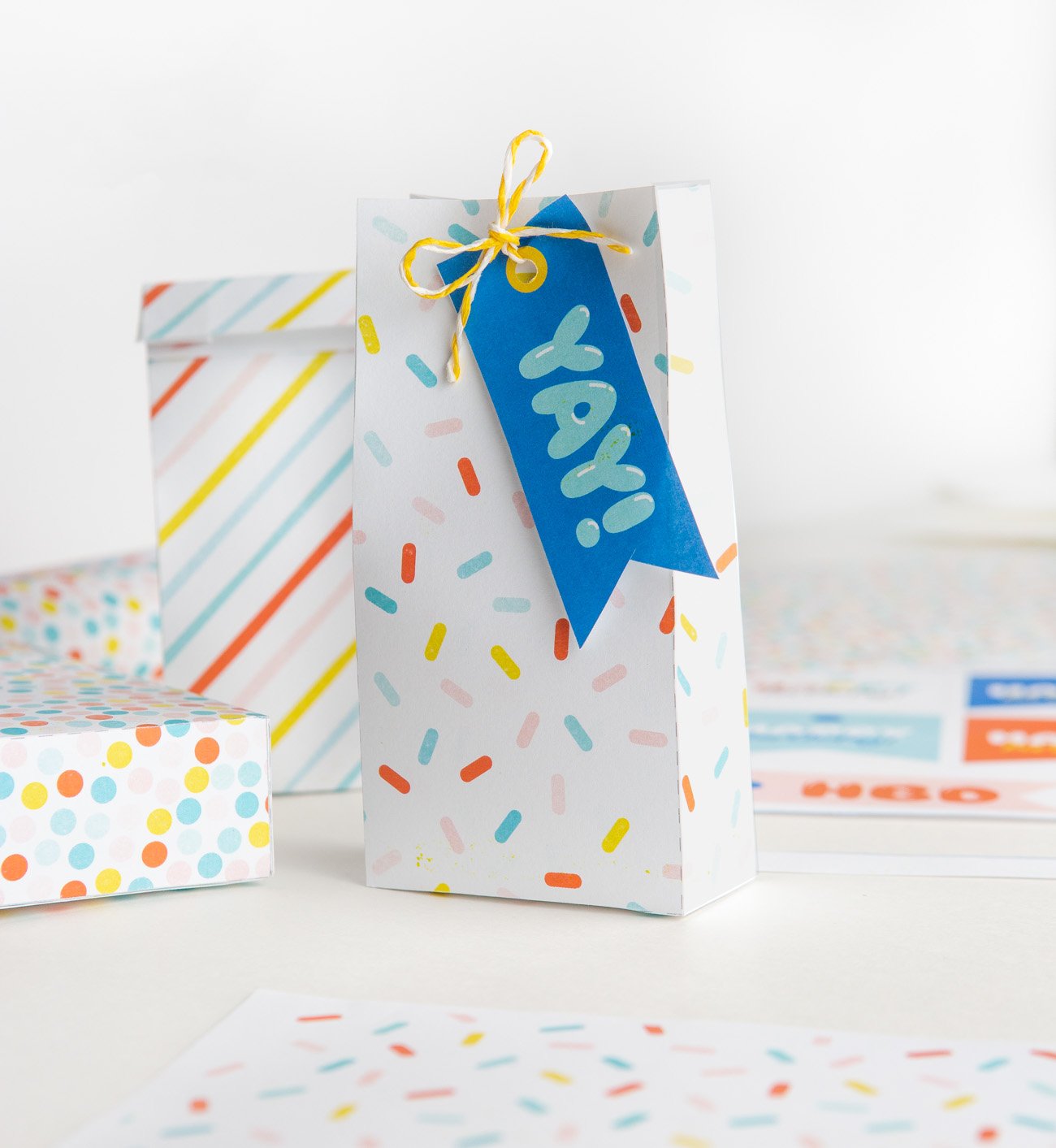 Colorful sprinkle printable treat bag with blue YAY birthday printable gift tag