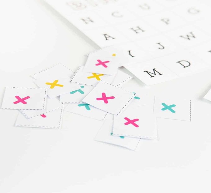 Small pieces of alphabet bingo marker squares