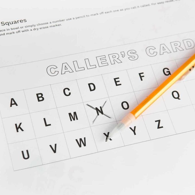 Alphabet Bingo Caller's Card with pencil crossing out letter