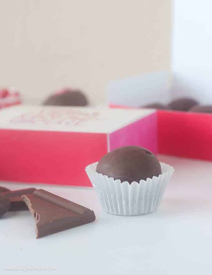 Homemade chocolate truffles in free Printable Chocolate Gift Box with phrase "there is no greater love than chocolate".