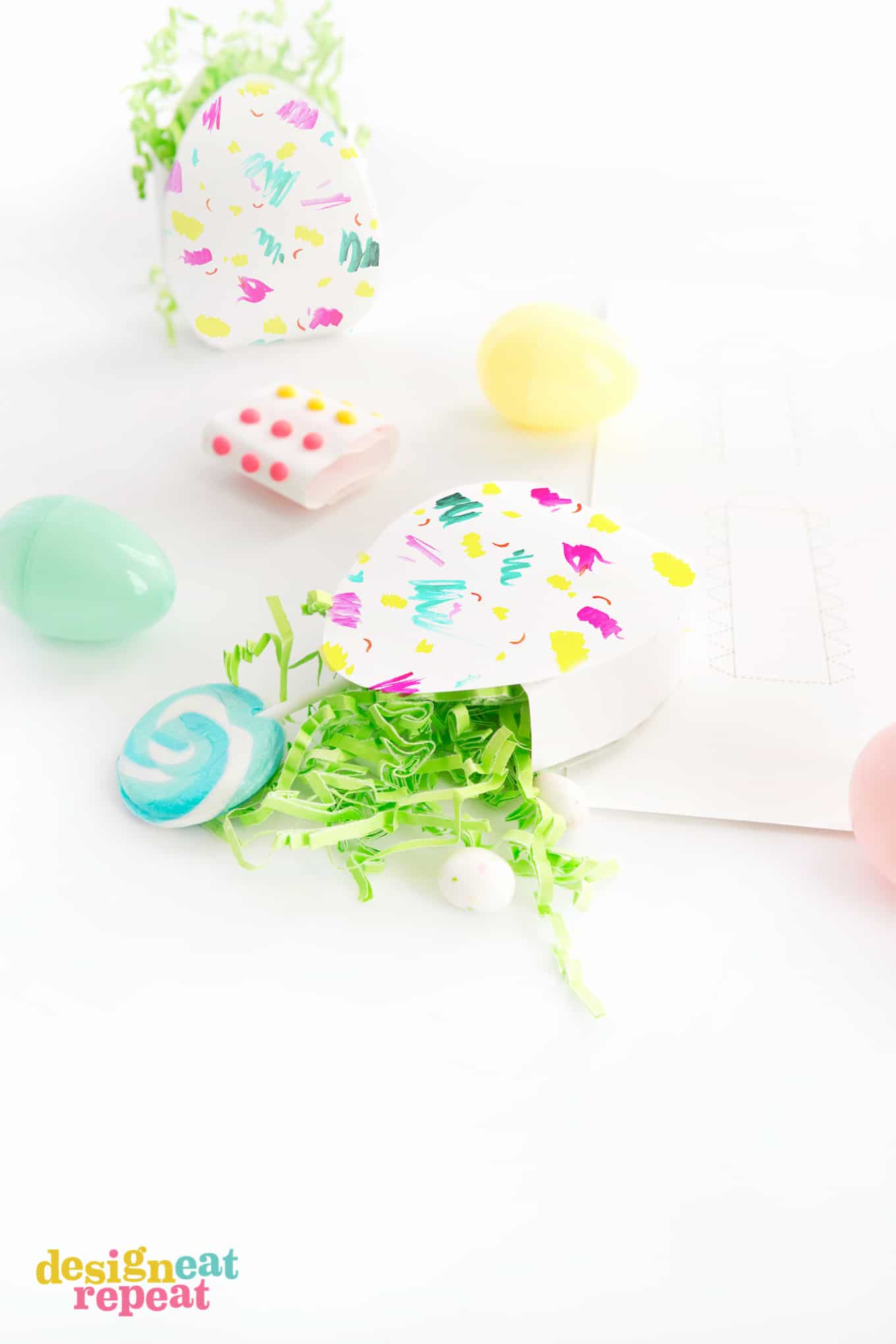 Download these bright & colorful Easter Egg Candy Boxes for a fun way to gift treats & trinkets!