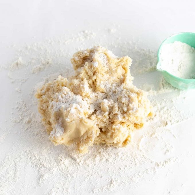 Ball of sugar cookie dough with flour dusted on top