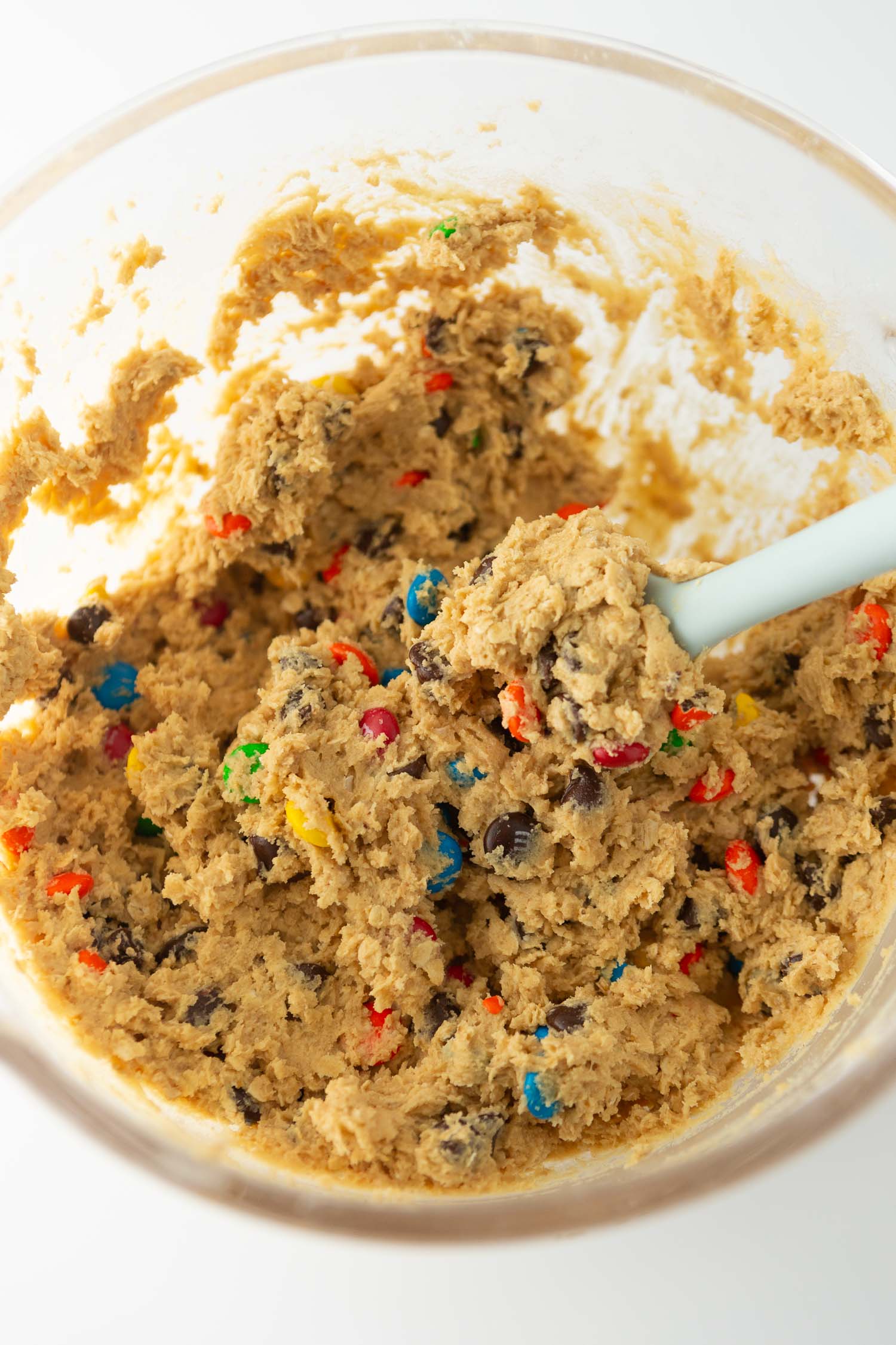 bowl of monster cookie dough with chocolate chips and m&m's