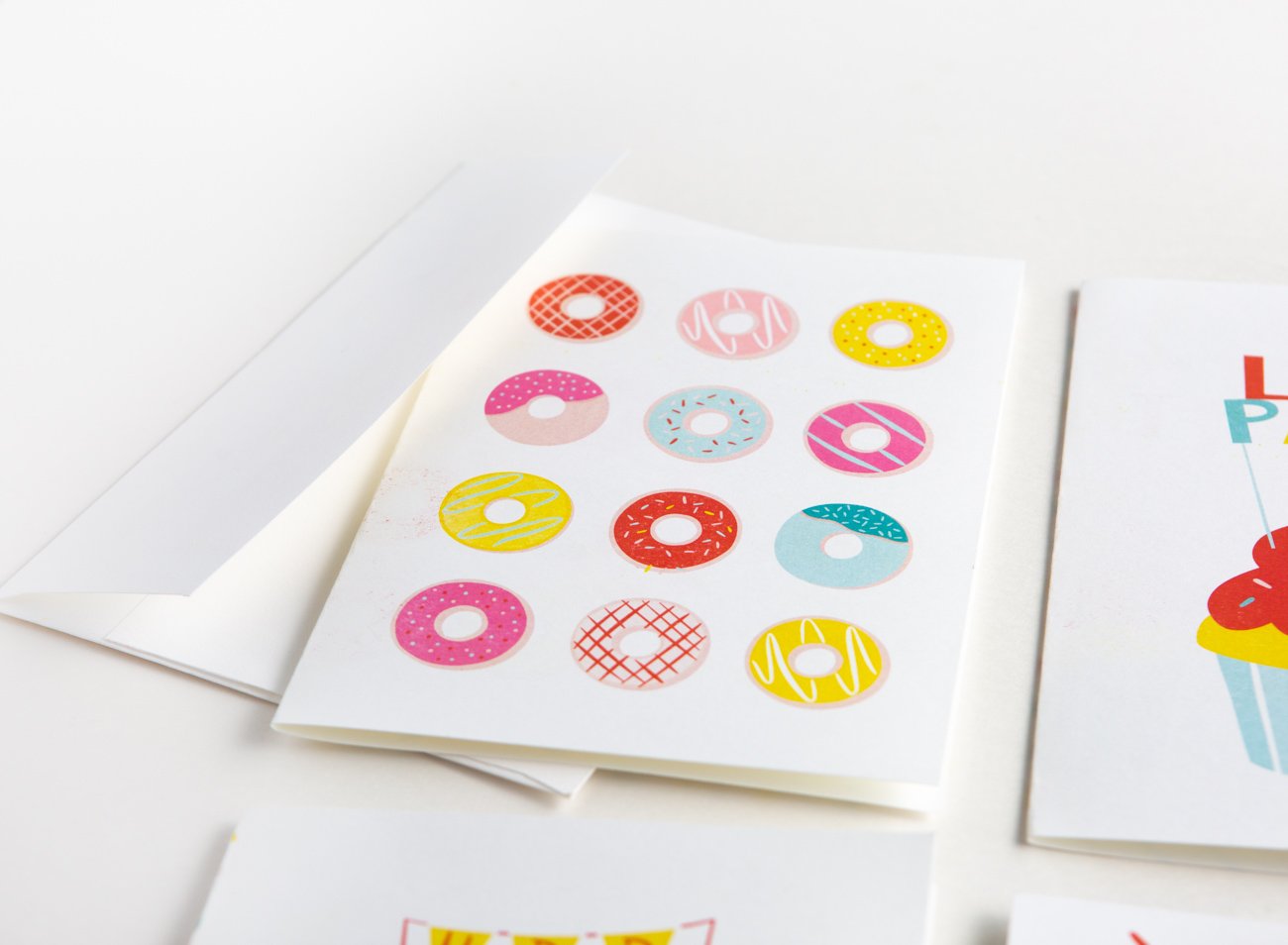 Free donut printable birthday card with rainbow donuts and sprinkles