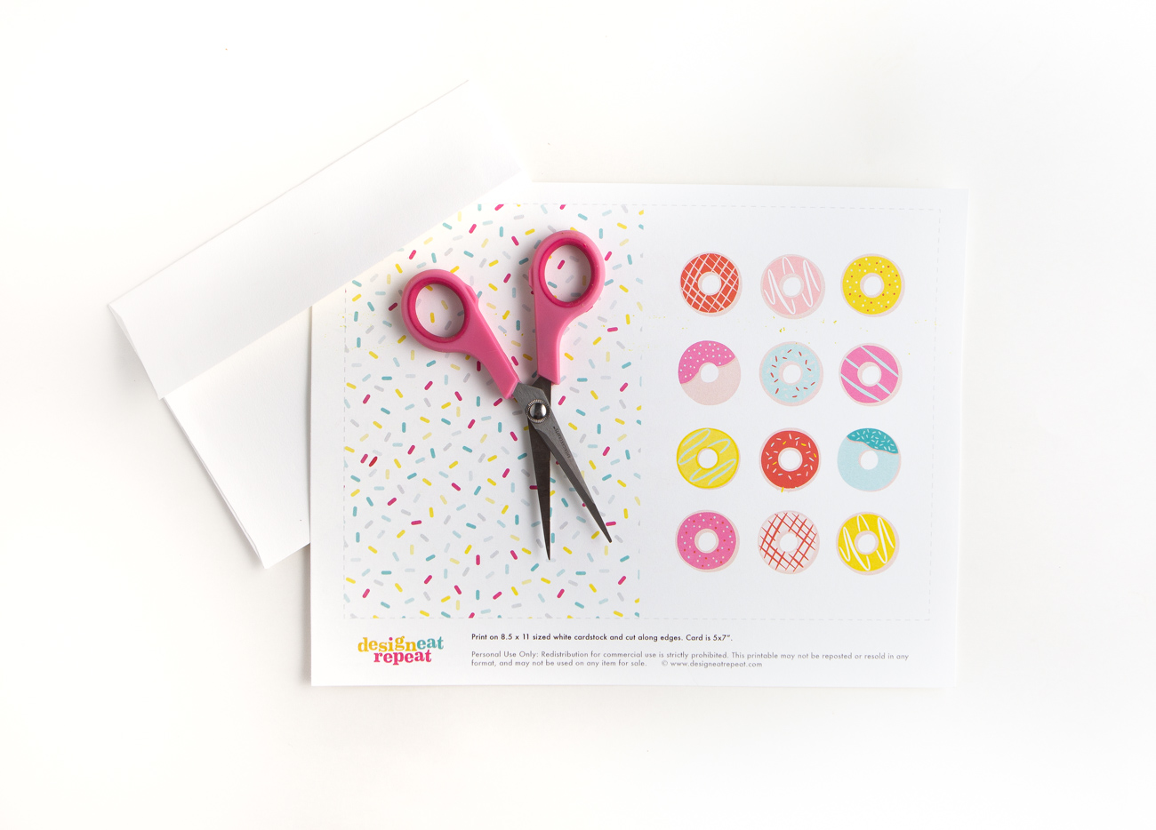 Printed sheet of a donut printable birthday card and scissors