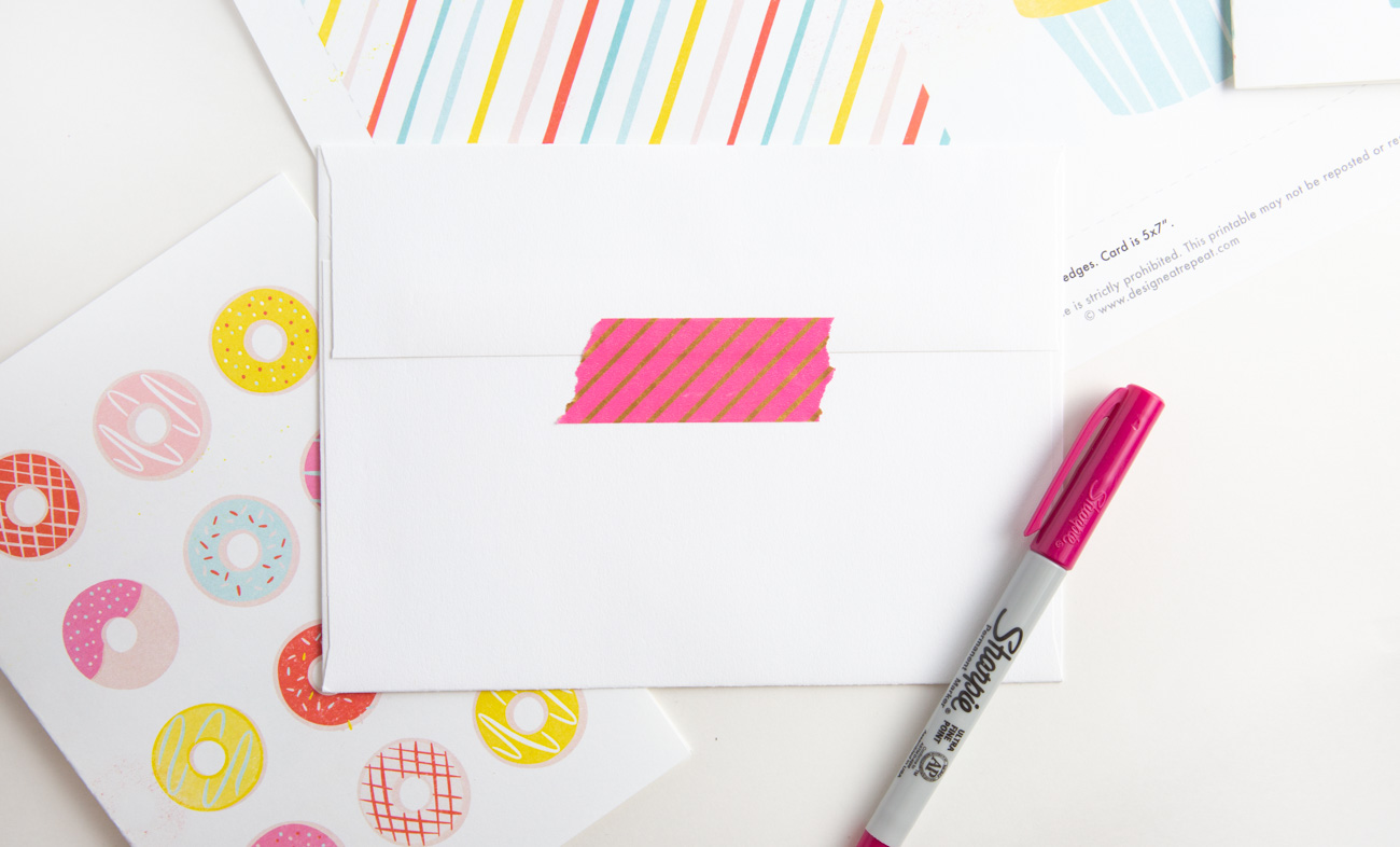 Envelope with pink washi tape for free donut printable birthday card with rainbow donuts and sprinkles