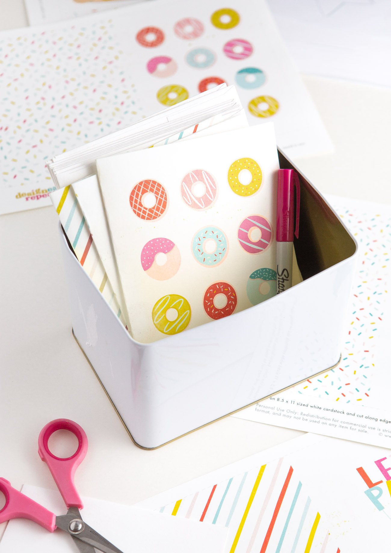 Free donut printable birthday cards in a tin box for a greeting card storage