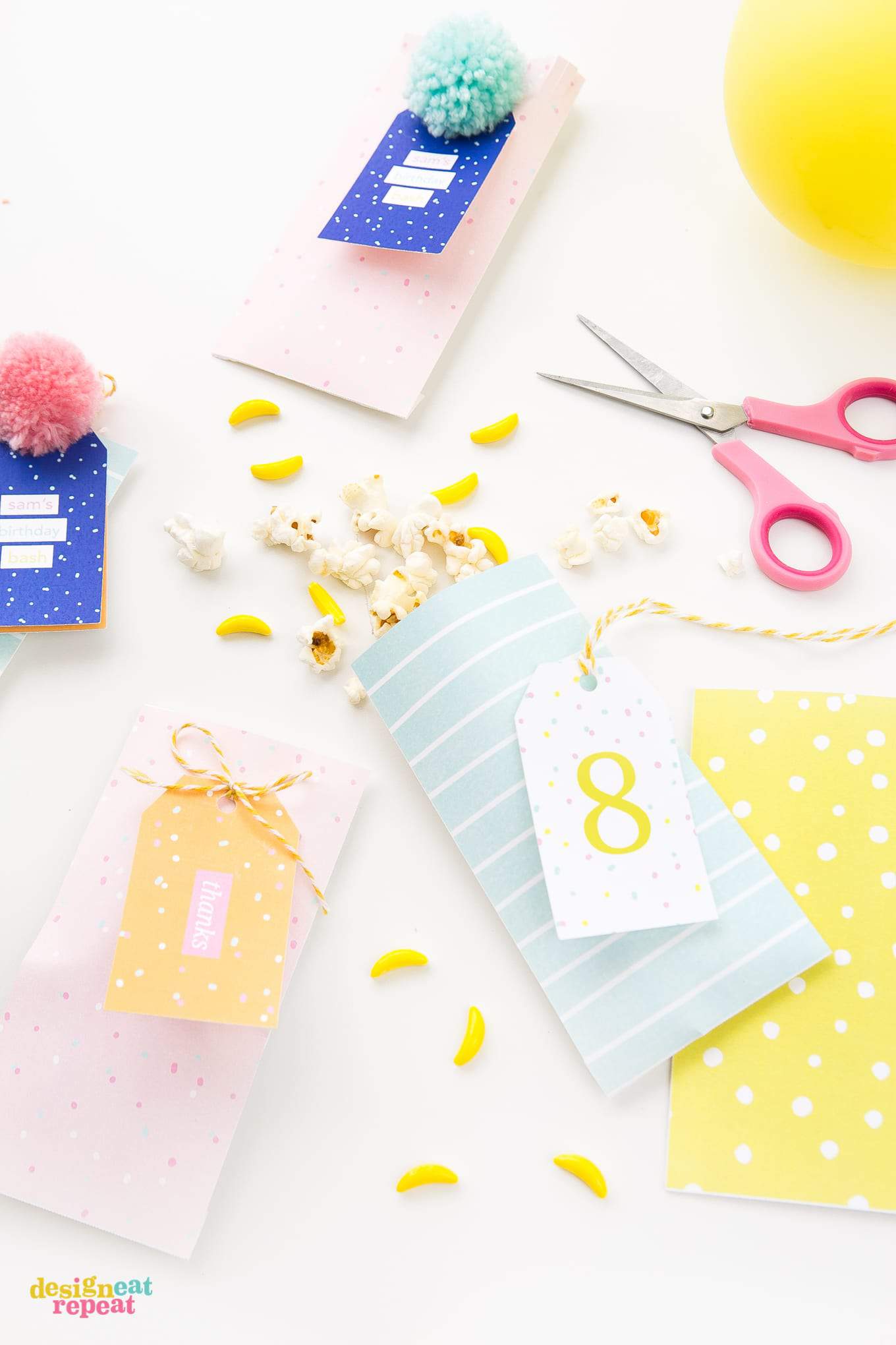 Pink, peach, blue, and yellow party favor bags with matching printable gift tags.