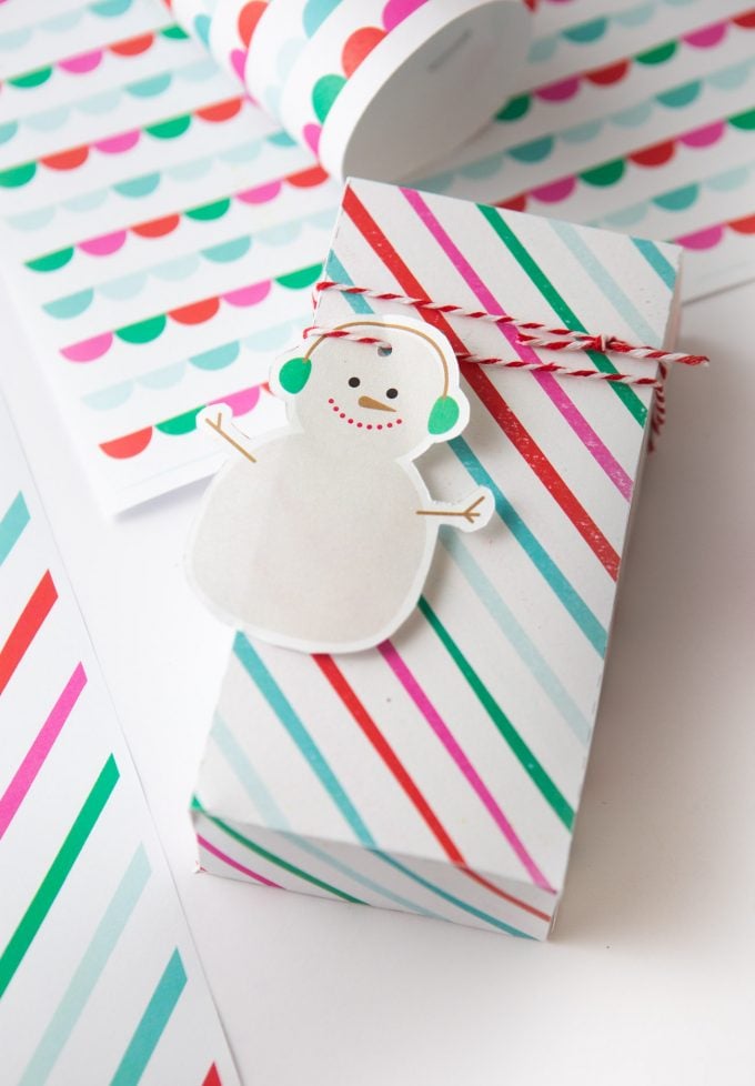 Printable snowman gift tag on striped rainbow gift box