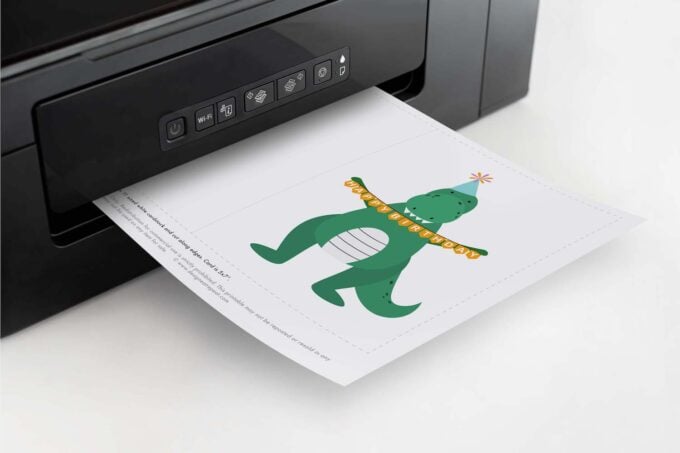 Printer printing a printable dinosaur birthday card