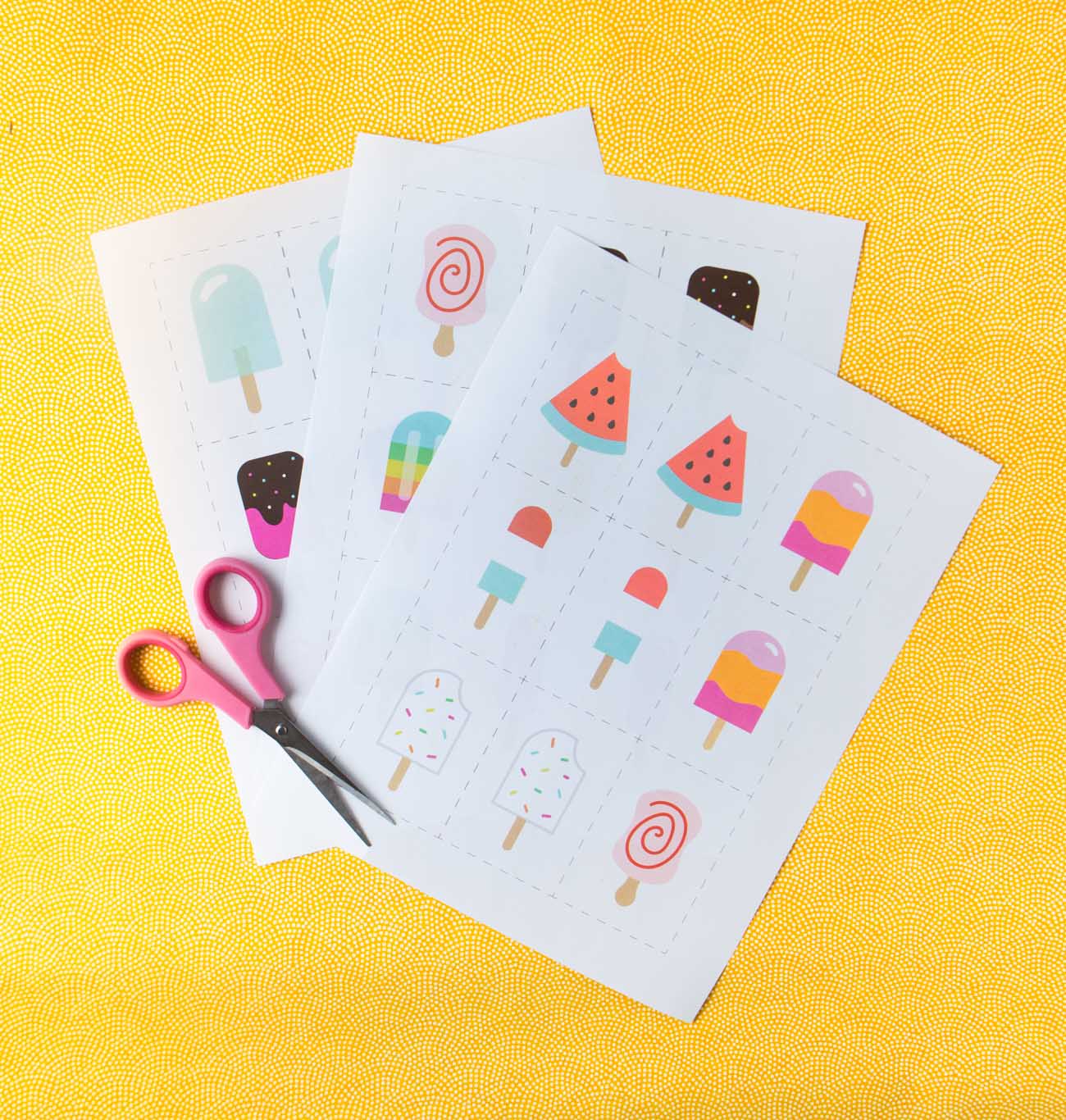 Printed sheets of paper with printable memory cards and scissors