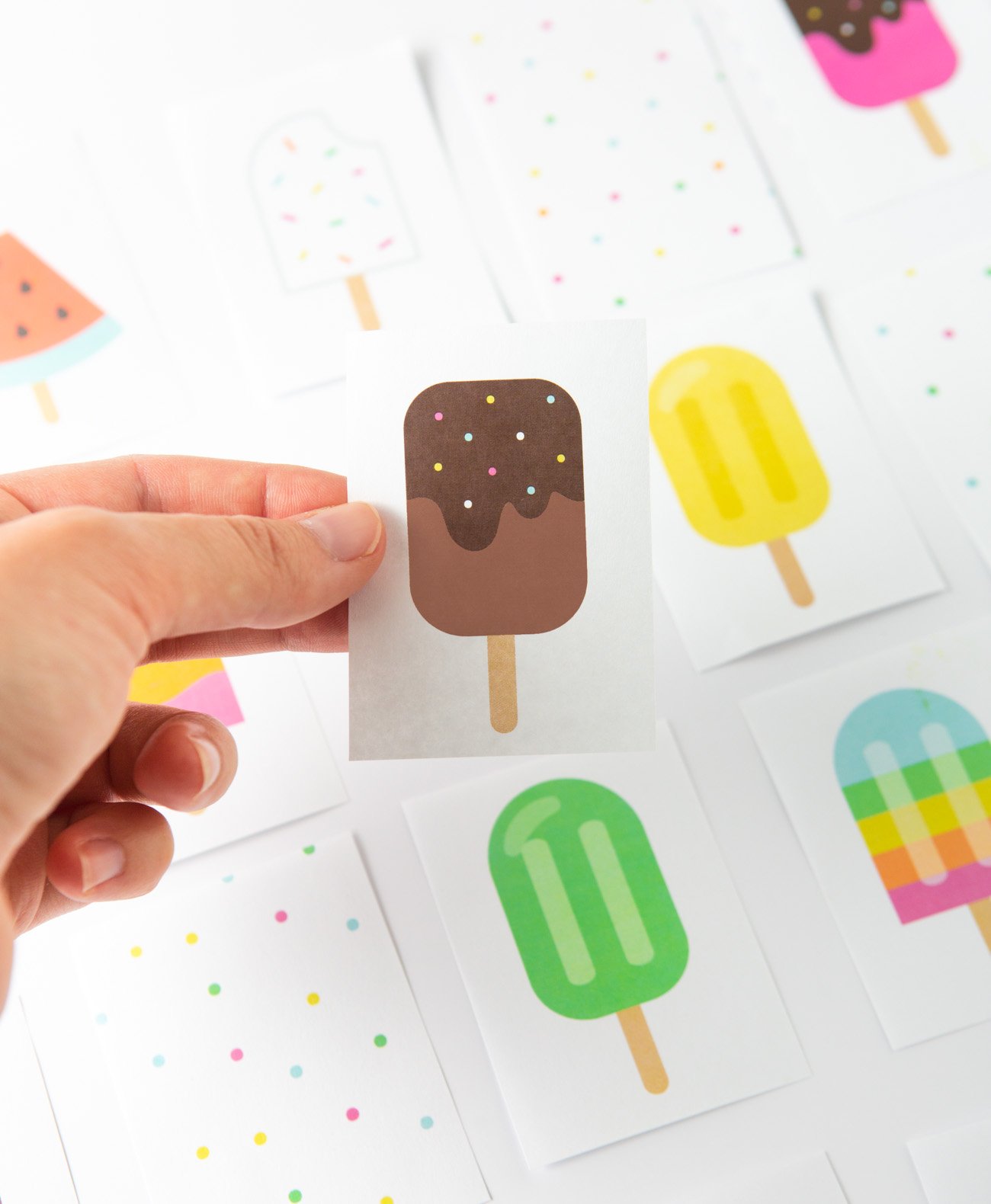 Hand holding chocolate popsicle printable memory card