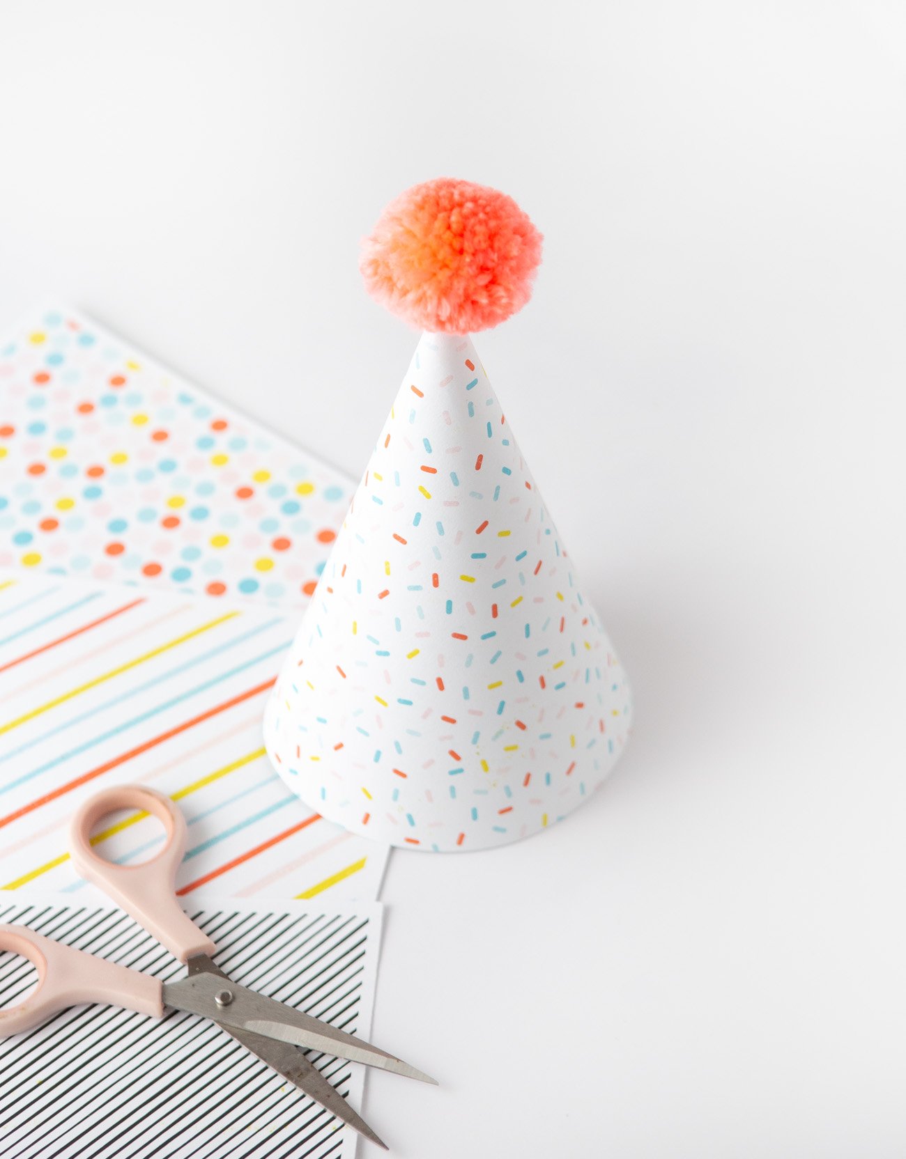 Sprinkle pattern party hat made with printable scrapbook paper