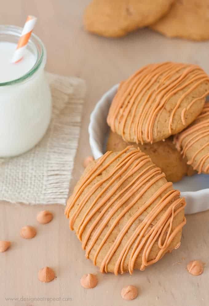 Soft Butterscotch Pumpkin Spice Cookies on wooden background with jar of milk